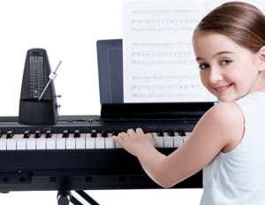 student practicing piano happily with the metronome
