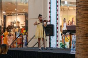 student performing during violin classes in Tampa