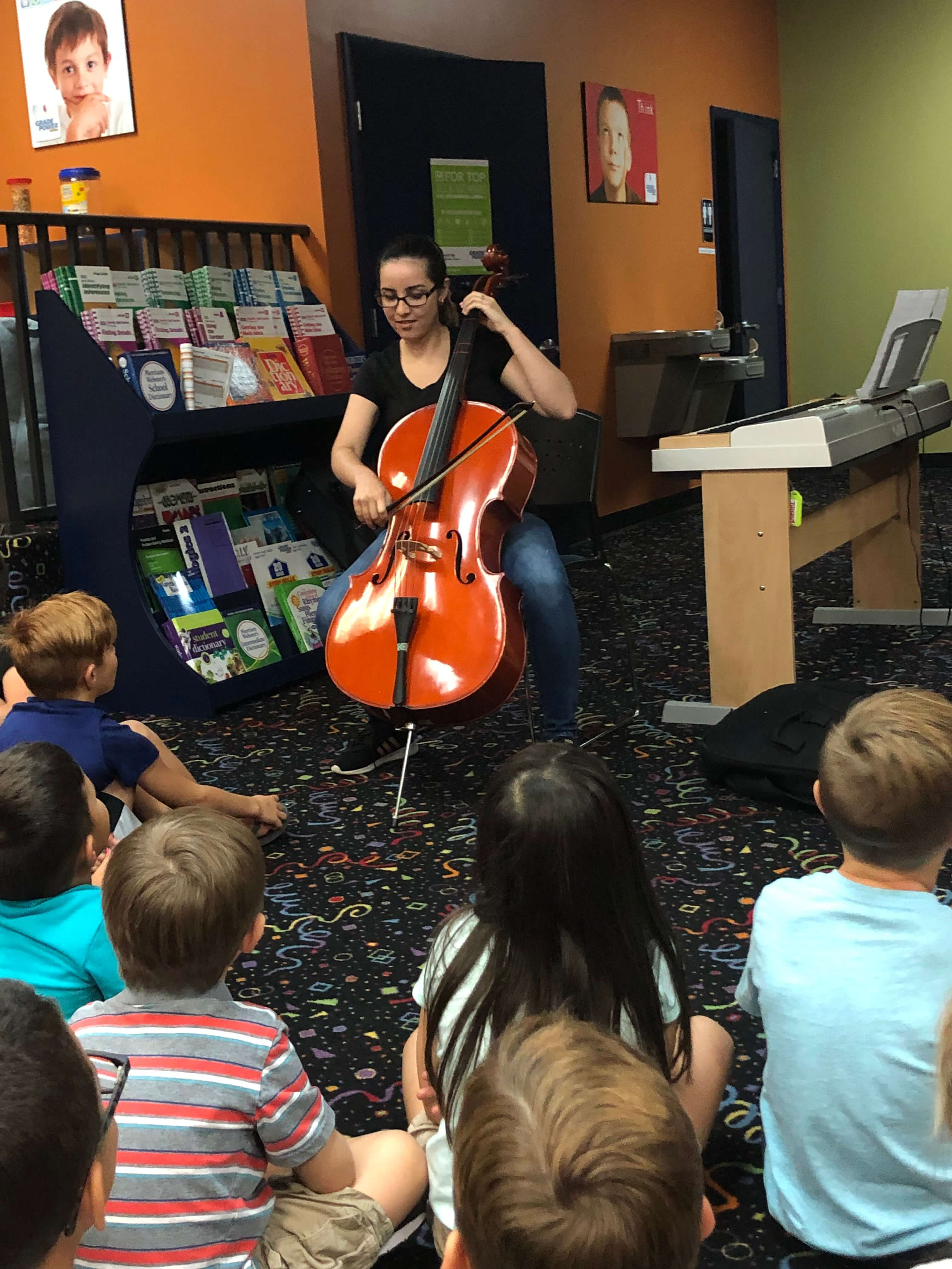 a teacher demonstration during cello lessons in Tampa