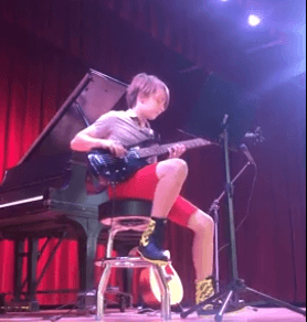 boy playing bass at a 2020 music summer camp in Tampa